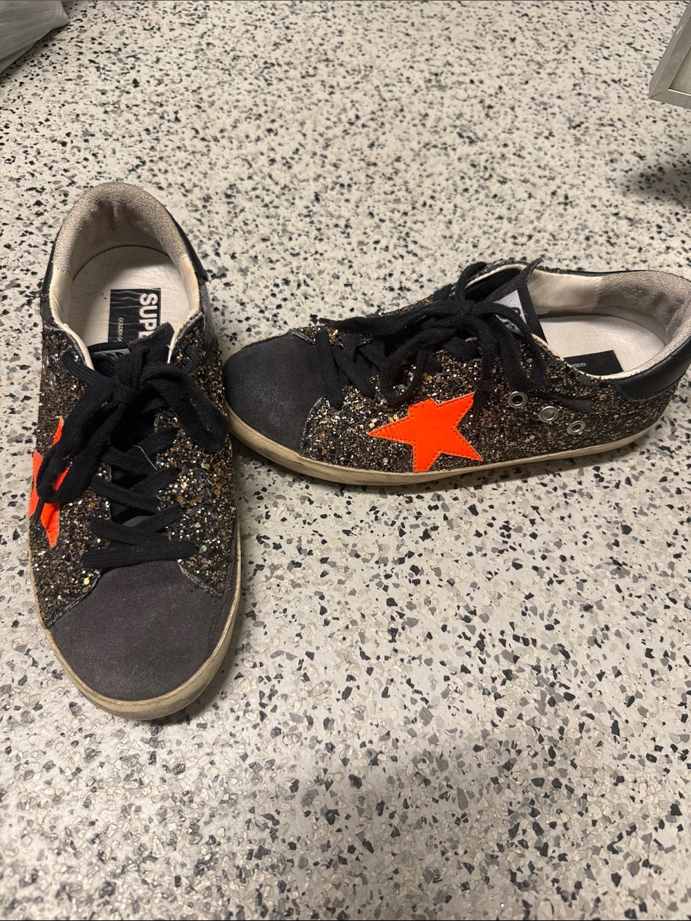 Golden Goose gold sparkle superstar’s with orange star
